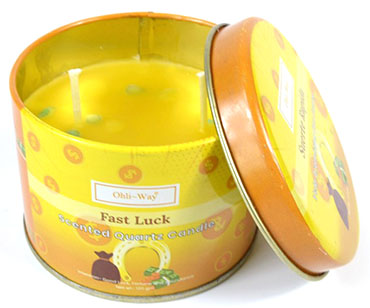 Fast luck quartz candle in a yellow tin with two wicks from www.Wolfmoon.store