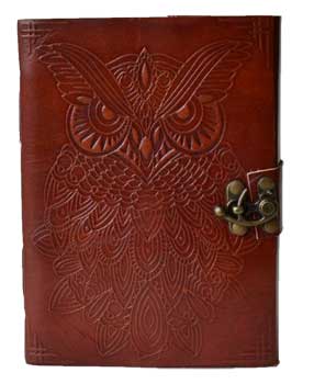 Owl leather journal with latch featuring intricate owl design on a rich brown cover