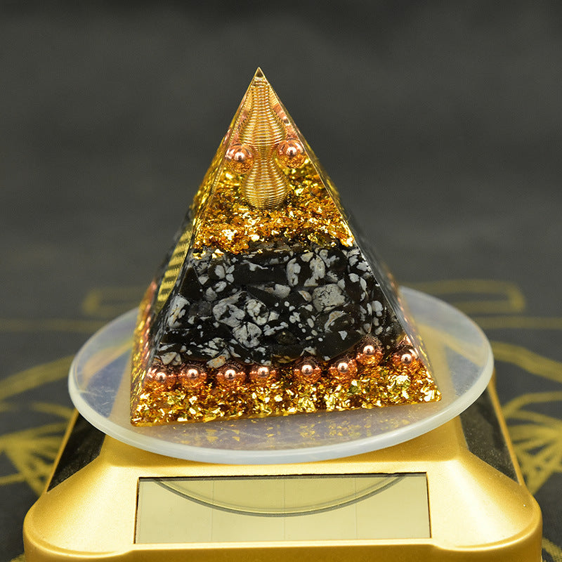 Wolf Moon CJ Reiki orgonite pyramid featuring vibrant gold and black resin with decorative elements