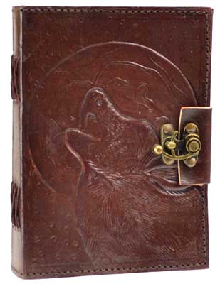 Wolf moon leather journal with embossed wolf design and brass closure for writing or sketching