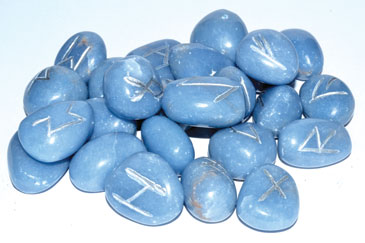 Angelite rune set featuring polished blue stones with engraved symbols for divination