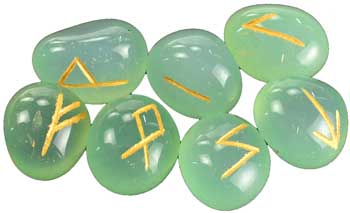 Aquamarine rune set with eight polished gemstones, engraved with ancient symbols for divination.