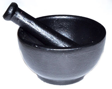 Cast iron mortar and pestle set for grinding herbs and spices, durable and stylish kitchenware.