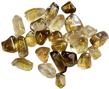 Citrine rune set from Wolf Moon Azure showcasing engraved symbols on polished stones