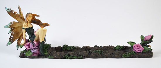 Fairy incense burner with a detailed fairy figure and floral decorations for a mystical ambiance