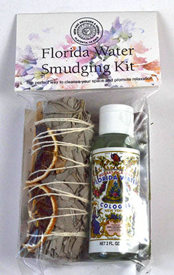 Florida Water smudge kit featuring dried herbs, citrus slices, and a bottle of cologne for cleansing and relaxation