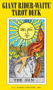 Cover of the Giant Rider-Waite Tarot deck book featuring The Sun tarot card with bright yellow background