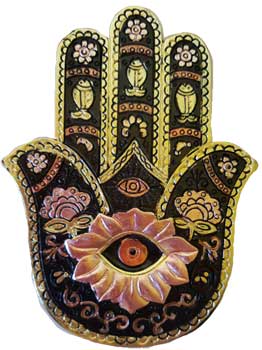 Gold black hamsa incense burner with intricate floral designs and an eye motif for spiritual spaces