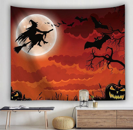 Halloween witch tapestry featuring a silhouette of a witch flying on a broom against a full moon