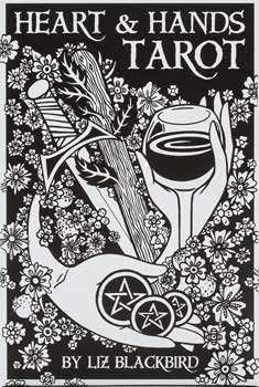 Heart and Hands tarot deck book cover featuring black and white floral design with hand holding a sword and a glass