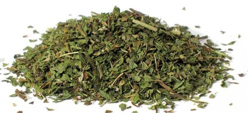 Dried spearmint herb cut in a pile, perfect for culinary and herbal uses