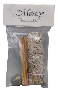 Money manifestation smudge kit featuring dried herbs, palo santo stick, and small stone for attracting abundance