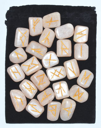 Moonstone rune set featuring 25 polished stones with gold etched symbols in a black velvet pouch