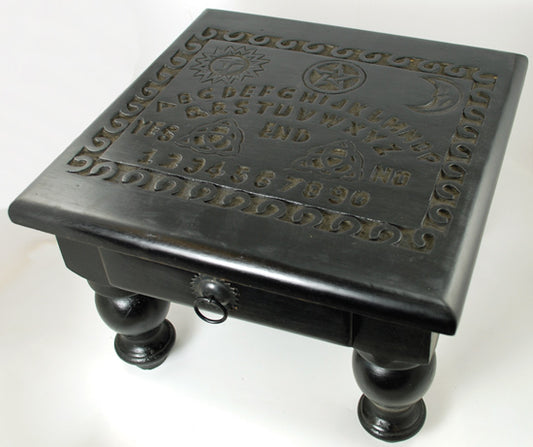 Black carved wooden spirit board altar table by wolf moon azure with sun and moon motifs and drawer ring pull