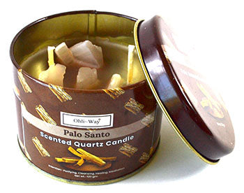 Palo santo quartz candle in a decorative brown tin container with quartz crystals inside