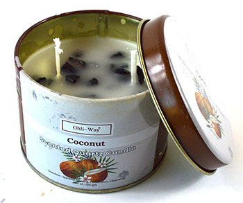 Coconut crystal candle in a round tin with two wicks and dark crystal pieces inside