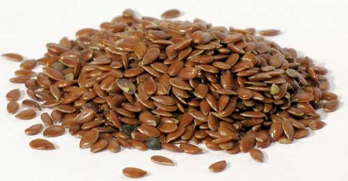 Organic flax seed for rituals in a pile, perfect for spiritual practices and herbal traditions