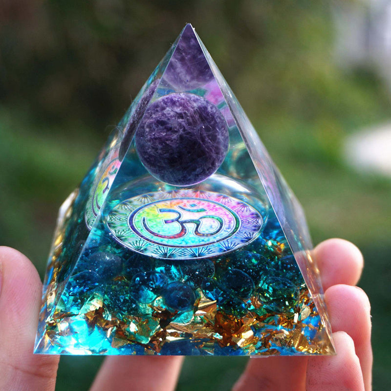 Wolf Moon Azure spiritual protection crystal pyramid with vibrant colors and a decorative design