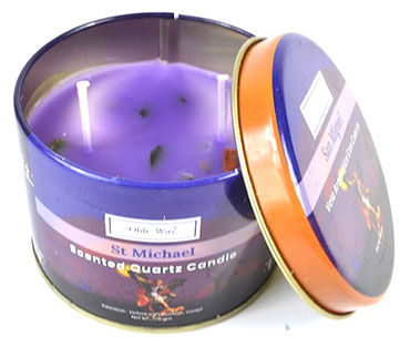 St Michael quartz candle in a purple wax metal tin by www.Wolfmoon.store with lid partially open