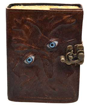 Two eyes leather journal with latch featuring a unique embossed design and vibrant blue eyes on the cover
