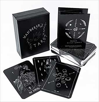 Wanderer's Tarot deck black box with black and white illustrated tarot cards and guidebook