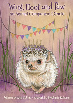 Wing Hoof Paw animal oracle deck featuring a hedgehog on the cover with colorful bunting and grass